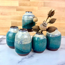 Load image into Gallery viewer, a collection of small bud vases. style inspired by heath pottery. shown in white and green glaze on Red stoneware clay