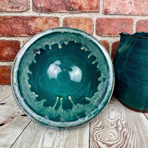Serving bowl glazed in Teal with a beautiful icing glazed rim.