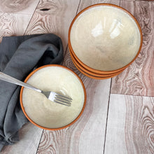 Load image into Gallery viewer, set of four stacking bowls, perfect size for soup, cereal, salad, or ice cream. These bowls are glazed with a Glossy, speckled, white glaze inside and feature the red-brown exposed stoneware clay on the exterior.