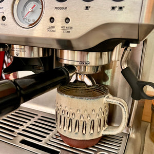 These hand carved, artisan mugs were made to fit into a Breville Espresso machine.