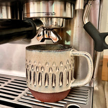 Load image into Gallery viewer, Hand carved, artisan made, wheel thrown pottery mug, shown here in a Breville Espresso machine.