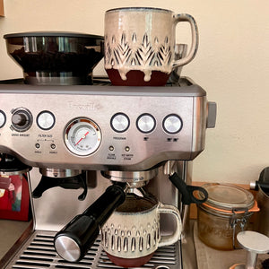 Espresso mugs, artisan made, hand carved. shown here with a Breville Espresso machine