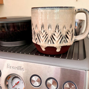 hand carved mug, warming on the Breville. This mug has some perfect glaze drips