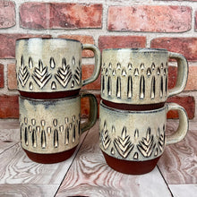 Load image into Gallery viewer, stackable carved coffee mugs with verticla pattern and tree pattern. hand carved artisan made mug by Meredith Chernick