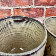 Load image into Gallery viewer, detail image of the inside of carved mugs. the rings shown inside the mug are texture from when the mugs were thrown by hand on the pottery wheel. 