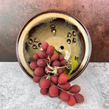 Load image into Gallery viewer, Pint size berry colander. Wheel thrown pottery, red stoneware shown in Caramel glaze.