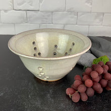 Load image into Gallery viewer, A wheel thrown pottery colander in speckled white glaze. 8&quot; diameter colander