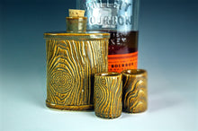 Load image into Gallery viewer, matching lumberjack flask and shot glasses. shown with bourbon in background. Fern Street Pottery.
