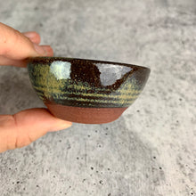 Load image into Gallery viewer, side view of a tiny bowl, showing the depth and the subtle lines formed when throwing the bowl on the potters wheel.