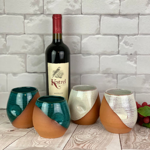 pottery wine tumblers. wheel thrown with finger divots added. shown here in rich teal and rustic white.