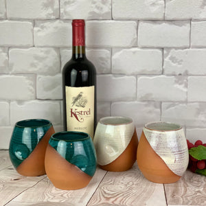 pottery wine tumblers. wheel thrown with finger divots added. shown here in rich teal and rustic white.