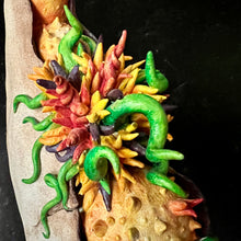 Load image into Gallery viewer, detail image of my Seed Pod Sculpture, &quot;Sprouting Pod&quot;. Sculpted from stoneware it shows the dry outer husk in contrast with the vibrant blooming seeds which are growing and sprouting from within.