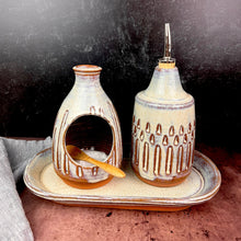 Load image into Gallery viewer, Salt cellar and Oil Cruet set with matching tray shown together here.  Made in  a red stoneware clay, carved and glazed in a speckled white glaze.