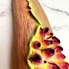 Load image into Gallery viewer, closeup image of a seedpod sculpture by meredith chernick of fern street pottery. the sculpture is made of porcelain and cold finished in bright colors with smooth hombre blends. this sculpture depicts a seedpod&#39;s husk with small protrusions emerging from within.