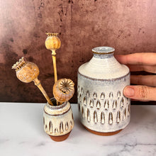 Load image into Gallery viewer, Bud vase thrown in red stoneware clay, carved and glazed in speckled white clay. Shown here along side a Mini Bud vase