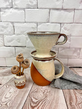 Load image into Gallery viewer, Coffee pour over and matching angle dipped mug and bud vase. shown in speckled white over rich red stoneware. Fern Street Pottery