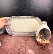 Load image into Gallery viewer, Salt cellar and Oil Cruet set with matching tray shown together here.  Made in  a red stoneware clay, carved and glazed in a speckled white glaze.