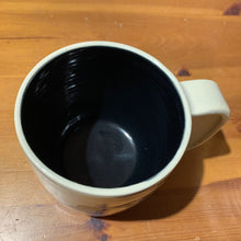 Load image into Gallery viewer, A wheel thrown mug shown with black glaze inside, Interior of a mug Glazed with the Glaze Splash Glaze Fountain