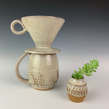 Load image into Gallery viewer, carved bud vase shown with carved mug and coffee pour over in speckled white glaze. all were thrown on the potters wheel by meredith at Fern Street Pottery