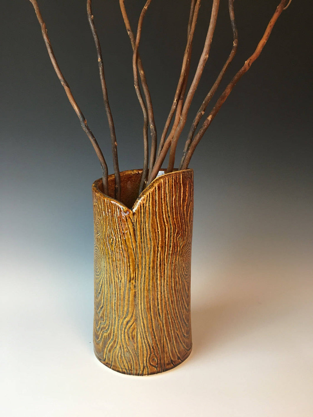 pottery vase, texturized to appear as woodgrain, log, tree