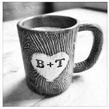 Load image into Gallery viewer, black and white photo of a custom carved lumberjack mug. the glaze enhances the carved texture and the initials.