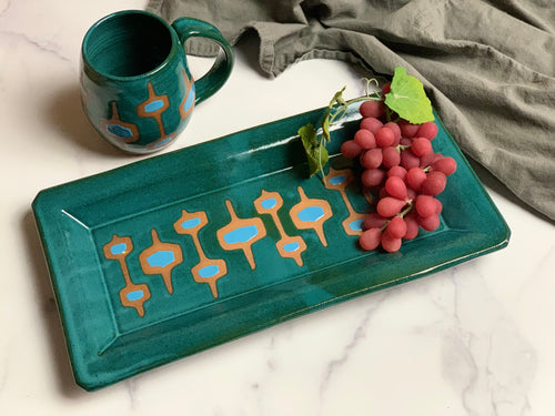 newly made, vintage style. This MidMod serving tray is designed to fit in with your MidCenturyModern style. shown here in Teal with turquoise accent, and some beautiful red stoneware clay showing through. also shown with a MidMod mug, sold separately